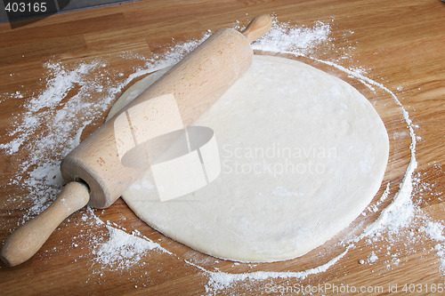 Image of rolling pizza