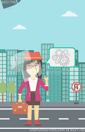 Image of Business woman pointing at cogwheels.