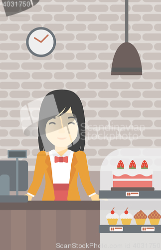 Image of Worker standing behind the counter at the bakery.