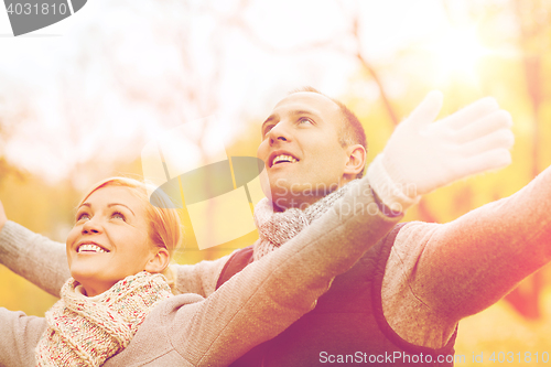 Image of smiling couple in autumn park