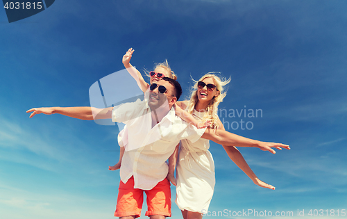 Image of happy family having fun over blue sky background