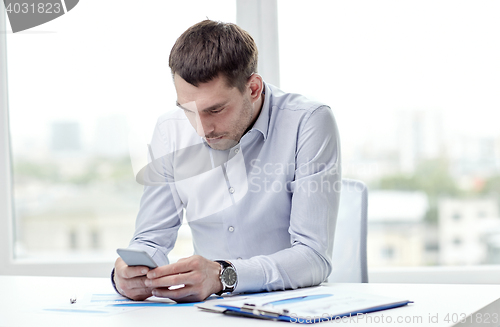 Image of close up of businessman with smartphone