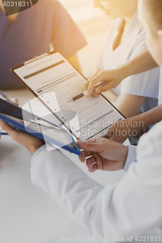 Image of close up of doctors with clipboard at hospital