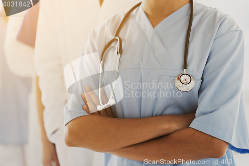 Image of close up of african female nurse with stethoscope