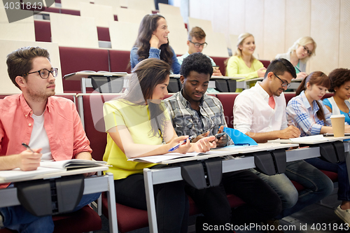 Image of group of students with smartphone at lecture