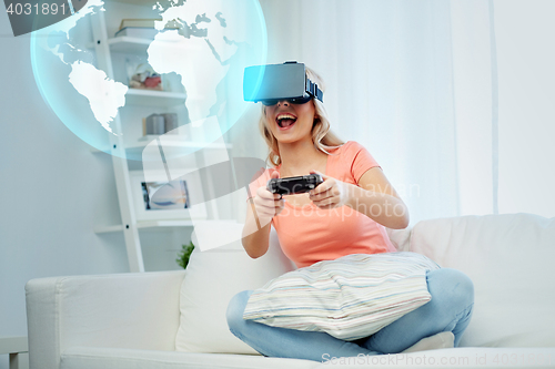 Image of woman in virtual reality headset with controller