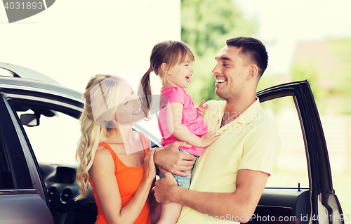 Image of happy family with child laughing at car parking