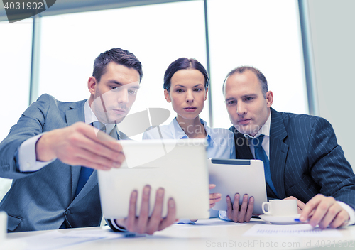 Image of business team with tablet pc having discussion