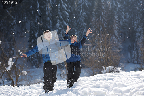 Image of kids playing with  fresh snow