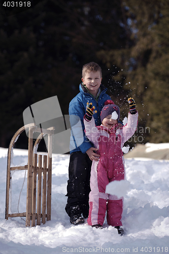 Image of Brother and sister portrait in winter time