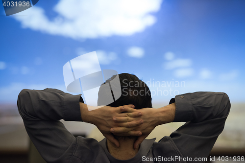 Image of young man dreaming clouds on presentation