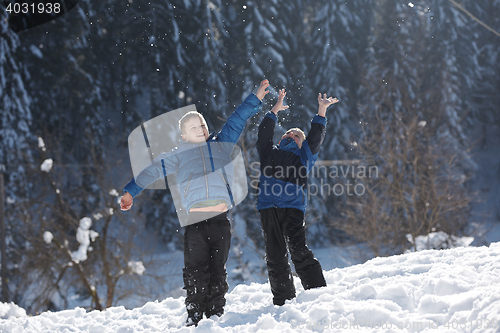 Image of kids playing with  fresh snow