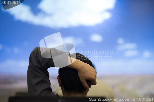 Image of young man dreaming clouds on presentation