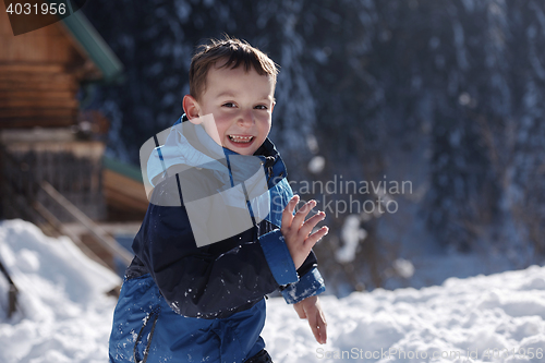 Image of kids playing with  fresh snow