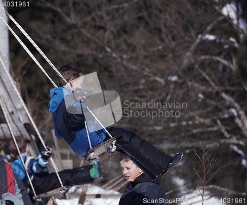 Image of kids playing with  fresh snow