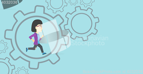 Image of Business woman running inside the gear.