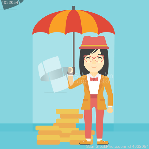 Image of Business woman with umbrella protecting money.