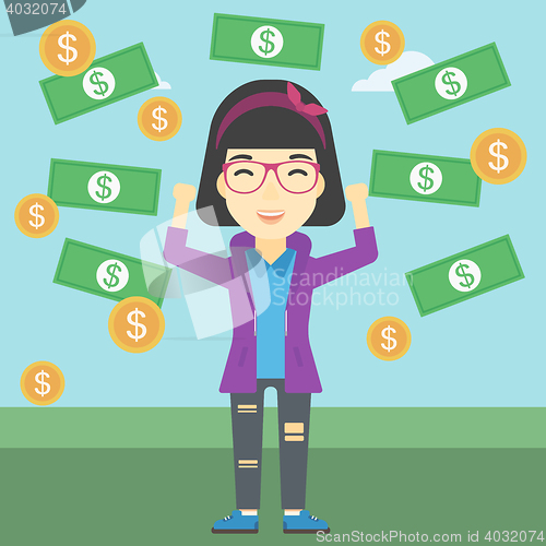 Image of Happy business woman under money rain.