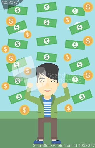 Image of Happy businessman under money rain.