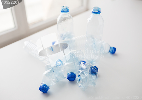 Image of close up of empty used plastic bottles on table