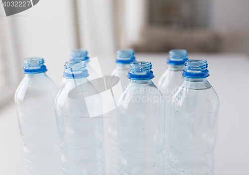 Image of close up of bottles with drinking water on table