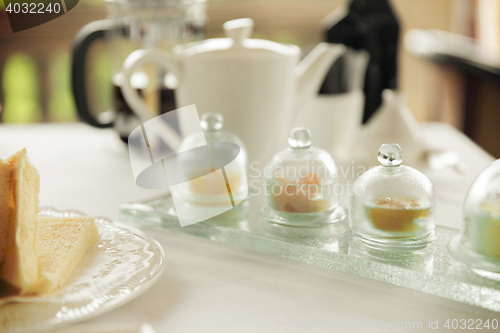 Image of close up of tea time set with jam on table