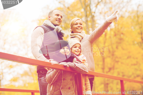 Image of happy family in autumn park