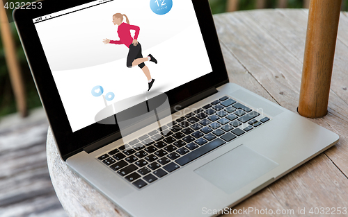 Image of close up of laptop computer with fitness app