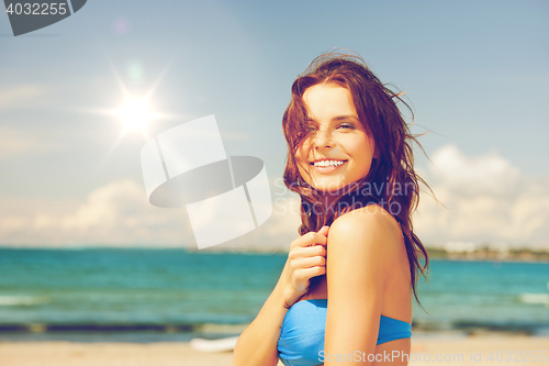 Image of happy beautiful woman on tropical beach