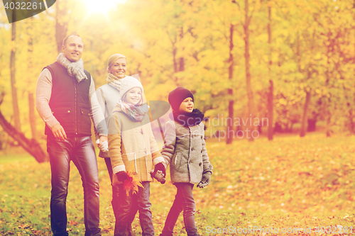 Image of happy family in autumn park