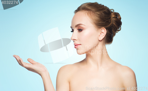 Image of smiling young woman face and shoulders