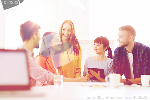 Image of happy creative team or students working at office