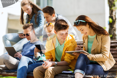 Image of group of students with tablet pc at school yard