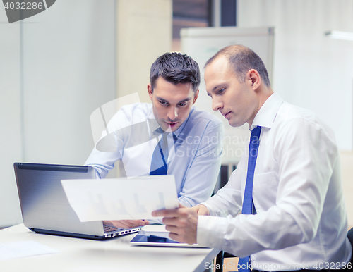 Image of two businessmen having discussion in office