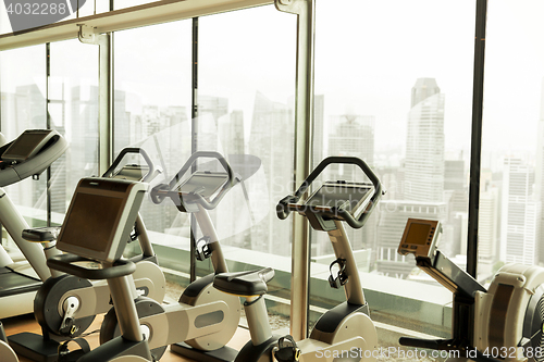 Image of exercise bikes in city gym