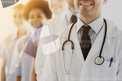 Image of close up of happy doctors with stethoscope