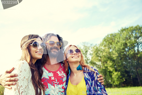 Image of smiling young hippie friends outdoors