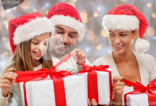 Image of happy family sitting on couch at home