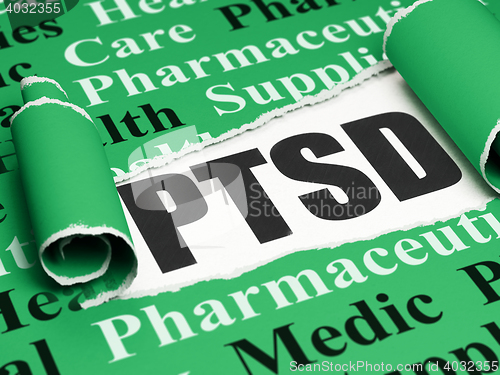 Image of Healthcare concept: black text PTSD under the piece of  torn paper