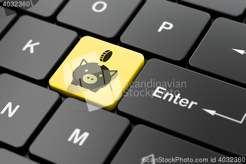 Image of Banking concept: Money Box With Coin on computer keyboard background