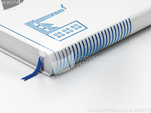 Image of Finance concept: closed book, Industry Building on white background