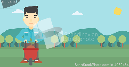 Image of Man with plant and wheelbarrow.
