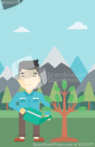 Image of Man watering tree with light bulbs.