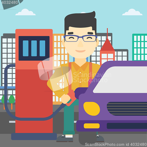 Image of Worker filling up fuel into car.