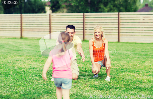 Image of happy family playing outdoors