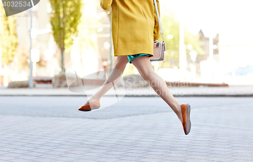 Image of young woman or teenage girl legs on city street