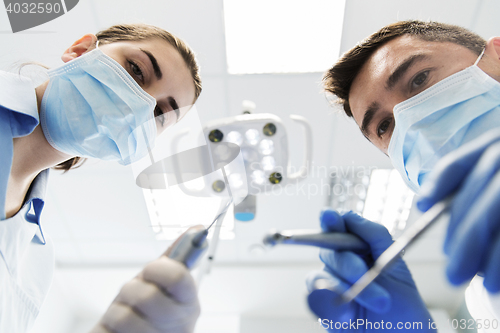 Image of close up of dentist and assistant at dental clinic