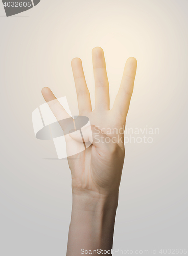 Image of close up of hand showing four fingers