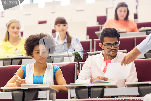 Image of international students with test on lecture