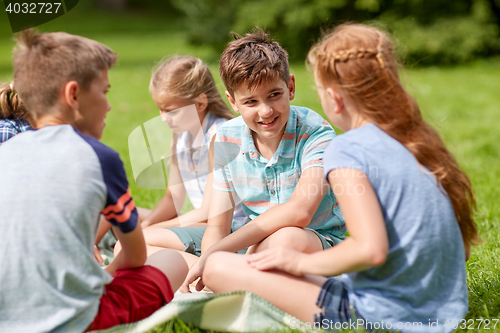 Image of group of happy kids or friends outdoors